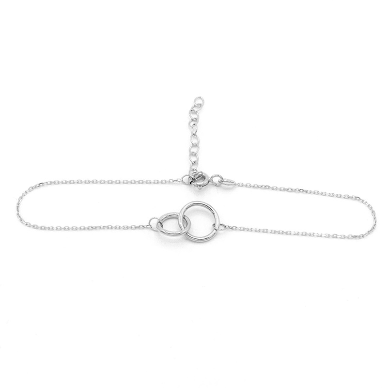 Náramek z bílého zlata s propletenými kolečky 