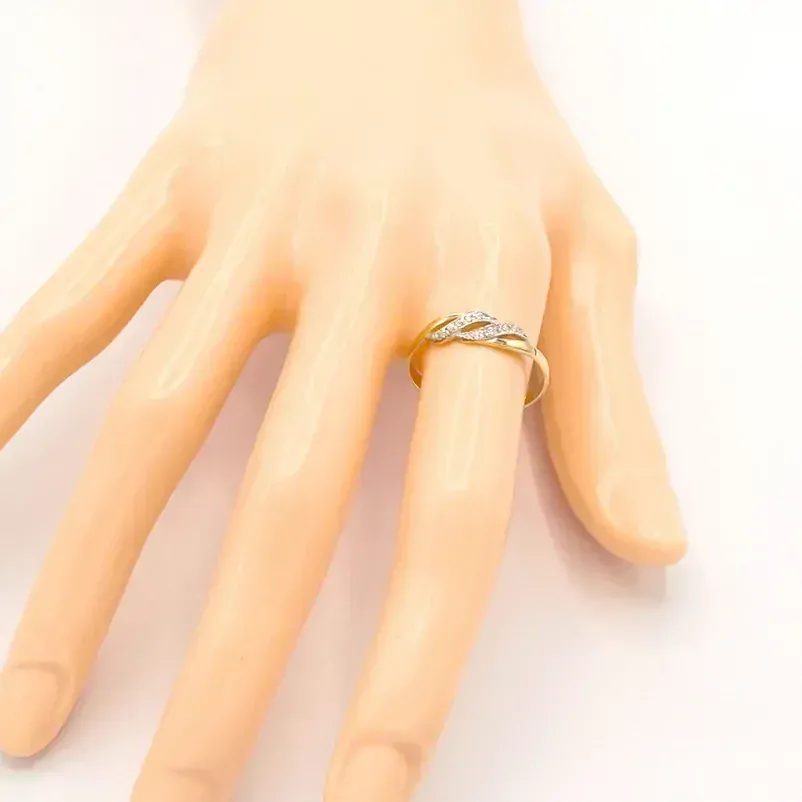 Zlatý prsten vlnky se zirkony dvě barvy zlata 1,33g 