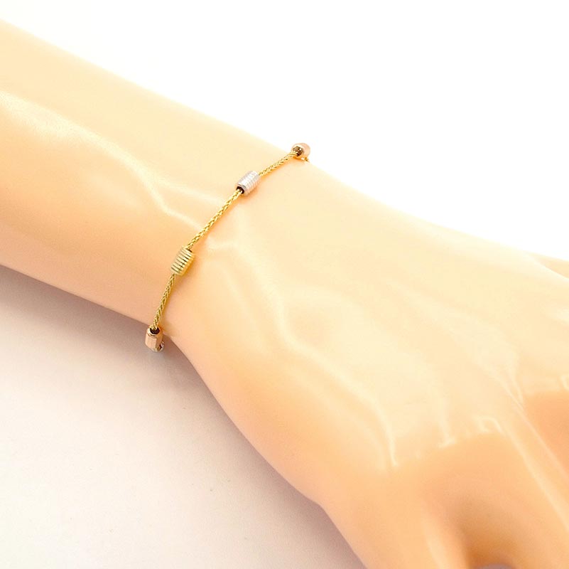 Zlatý náramek Spiga zdobený válečky tři barvy zlata 1,95g