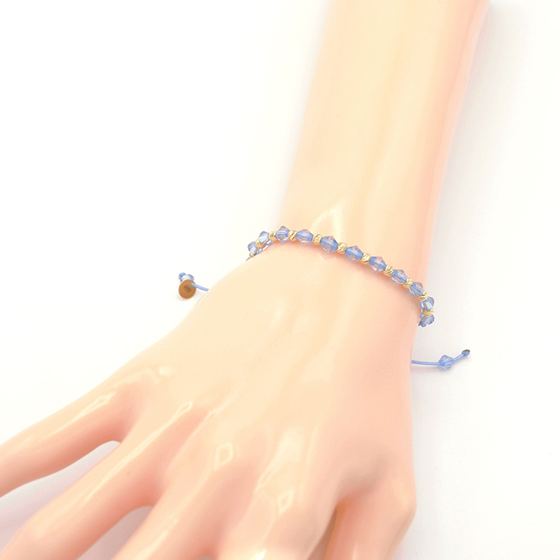 Náramek modrý provázek s modrými válečky a zlatými kuličkami 